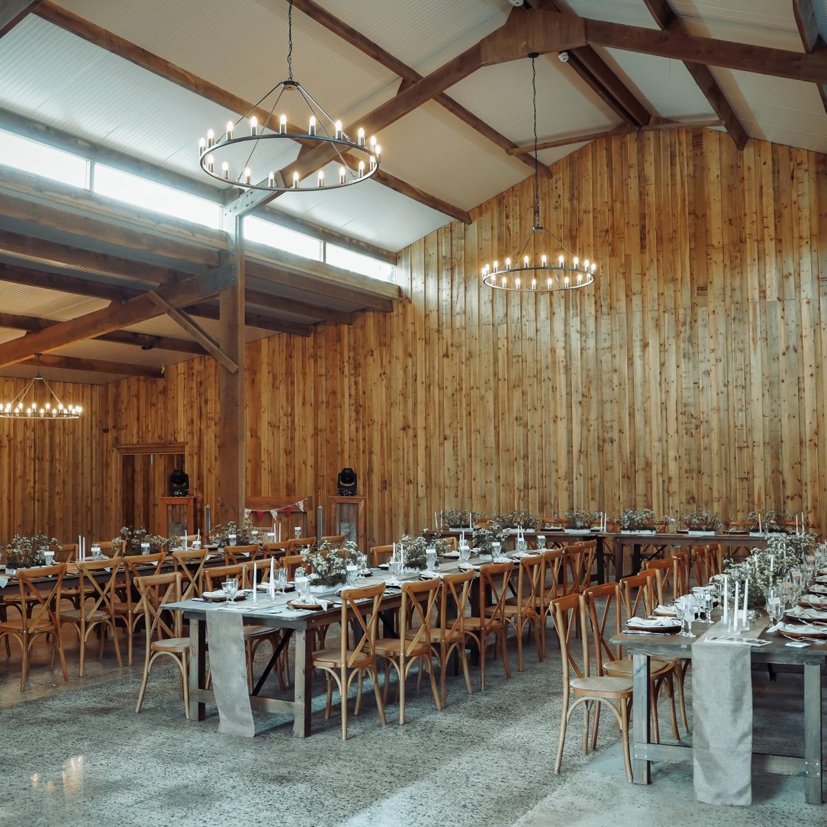 The barn at Wooladon Estate set up and decorated with tables and chairs ready for a wedding reception