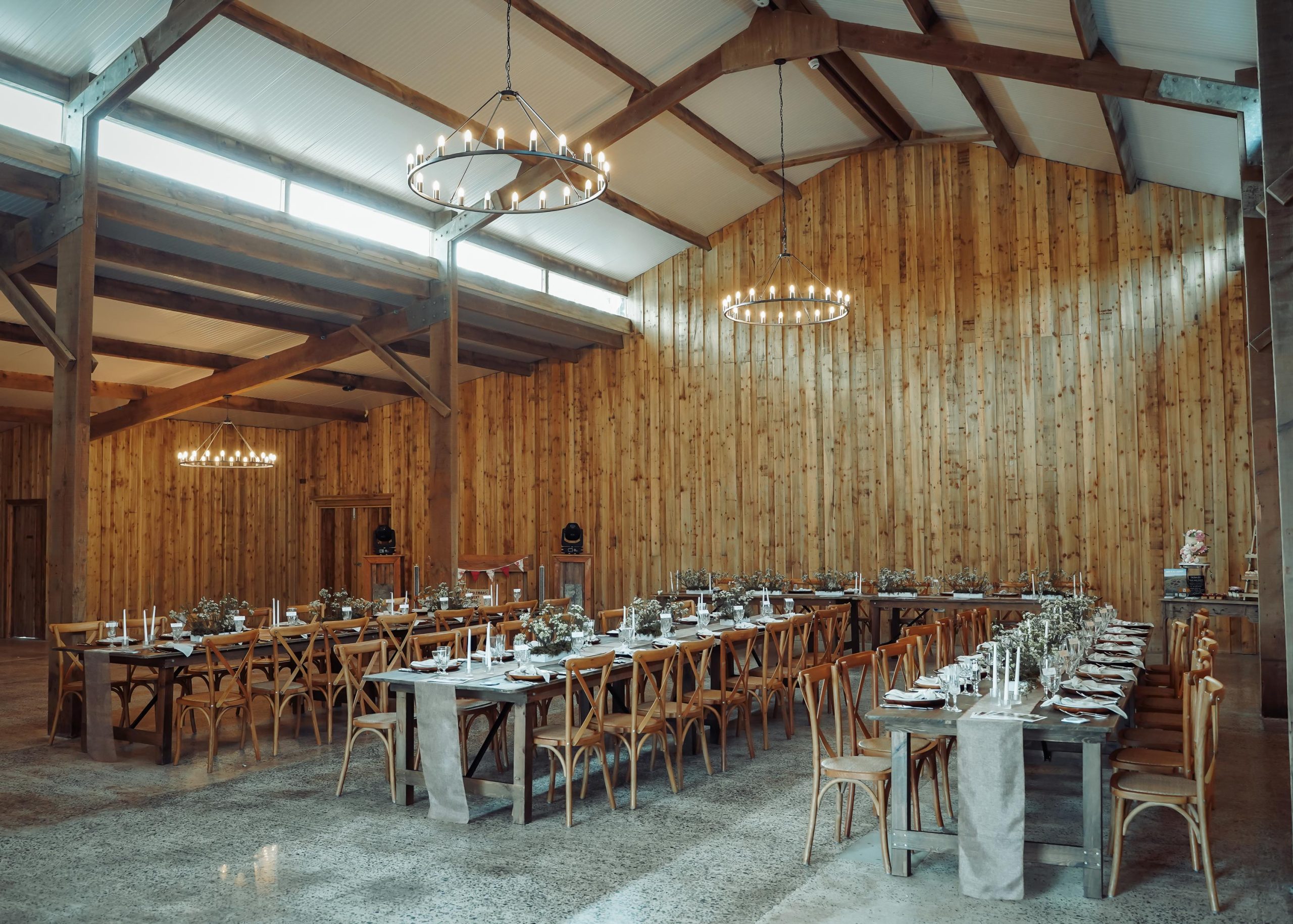 The barn at Wooladon Estate set up and decorated with tables and chairs ready for a wedding reception