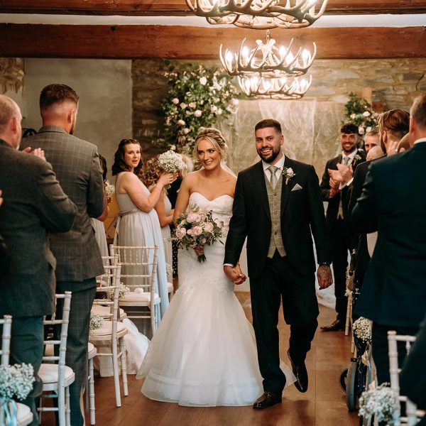 The bride and groom walking back down the aisle at Wooladon Estate together after their wedding ceremony