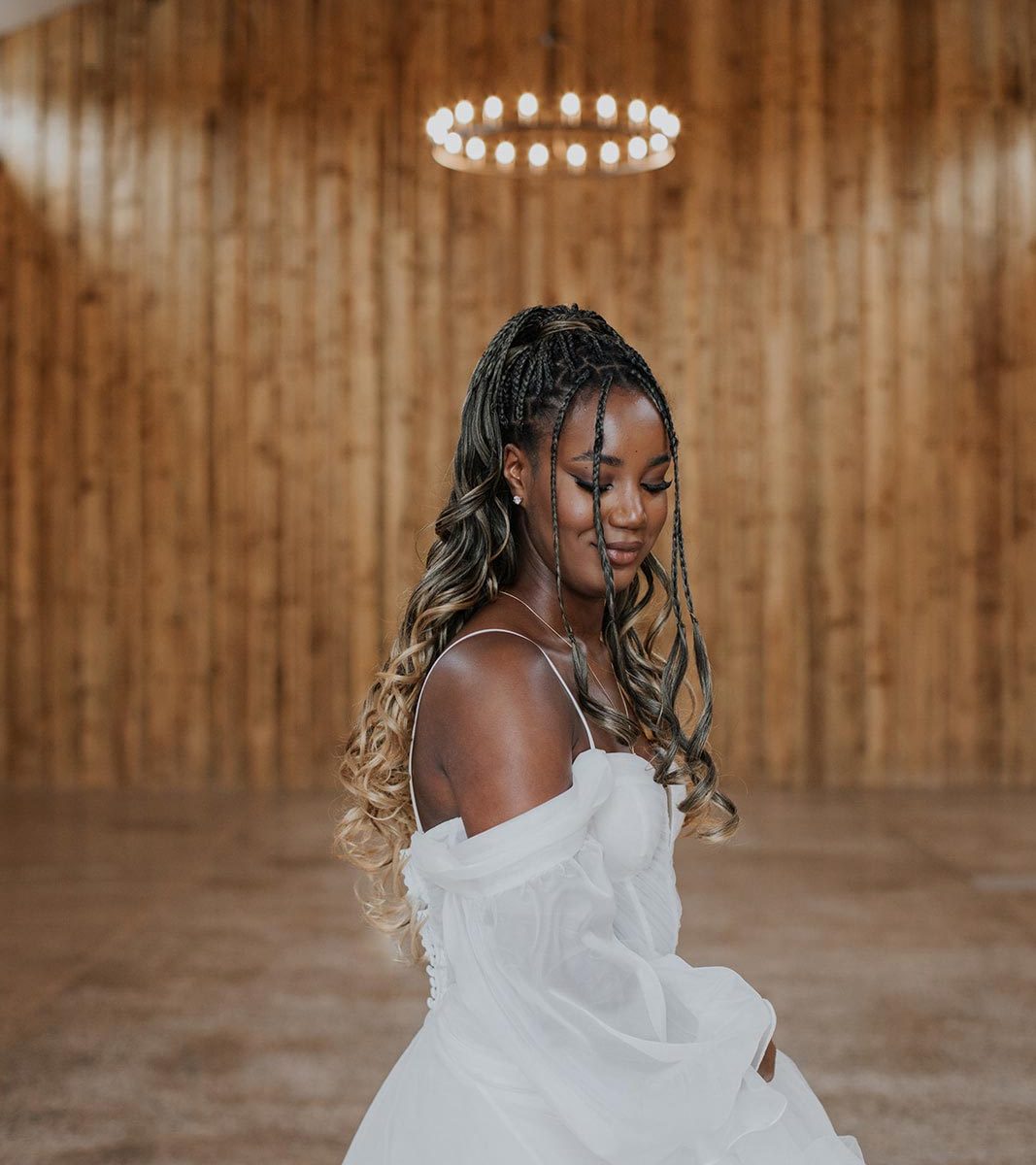 A beautiful bride standing in the middle of the barn at Wooladon Estate