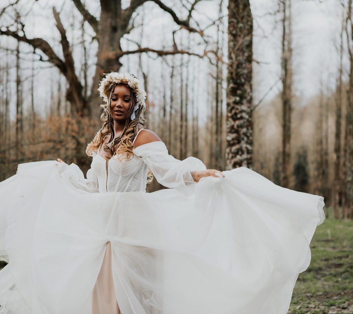 A bride walking through the woodland on Wooladon Estate