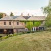 A view of the house with ivy on the exterior wall at Wooladon Estate